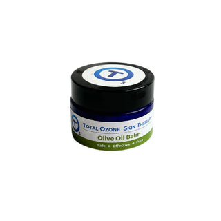 A small jar labeled 'Total Ozone Skin Therapy Olive Oil Balm' - Amaterasu Beauty