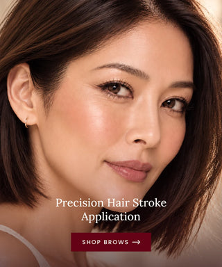 Close-up of a woman's face with text reading 'Precision Hair Stroke Application' and a 'SHOP BROWS ->' button, suggesting a brow or cosmetic service/product.
